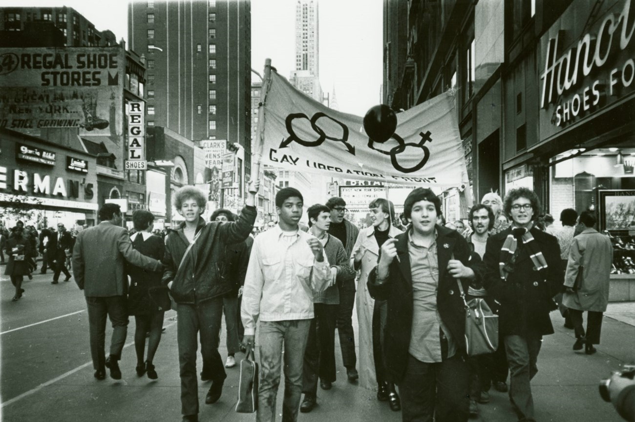 Gay Liberation Front Marches on Times Square with banner that reads 'Gay Liberation Front' 